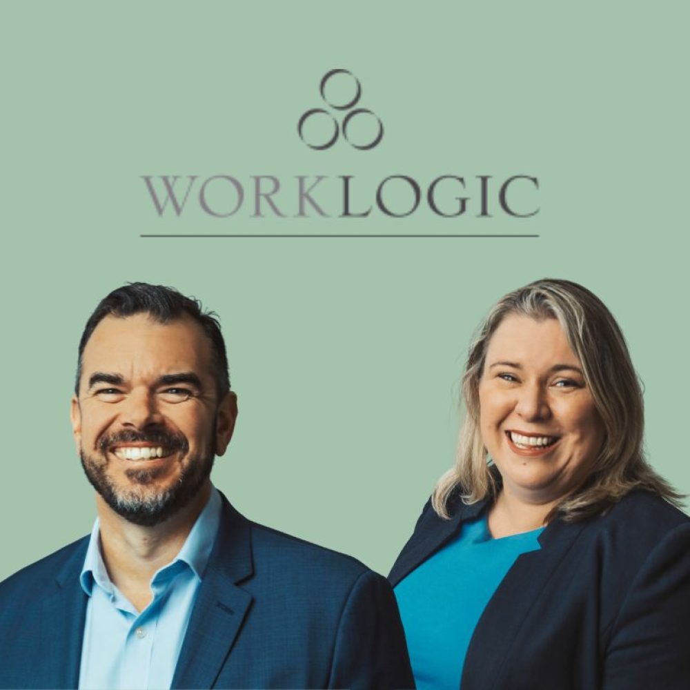 Man and woman in business attire smiling in front of Worklogic logo on green background